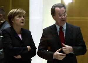 Angela Merkel (L) leader of Germany's conservative Christian Democratic Union party (CDU) chats with Franz Muentefering of the SPD prior to the coalition talks in Berlin October 17, 2005.
